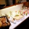 Breakfast buffet with bread, cold cuts and cheese.