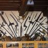 Wall with historical weapons and artifacts in the local history museum.