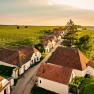 Aerial view of the wine cellar lane in Zellerndorf with vineyards and traditional buildings.