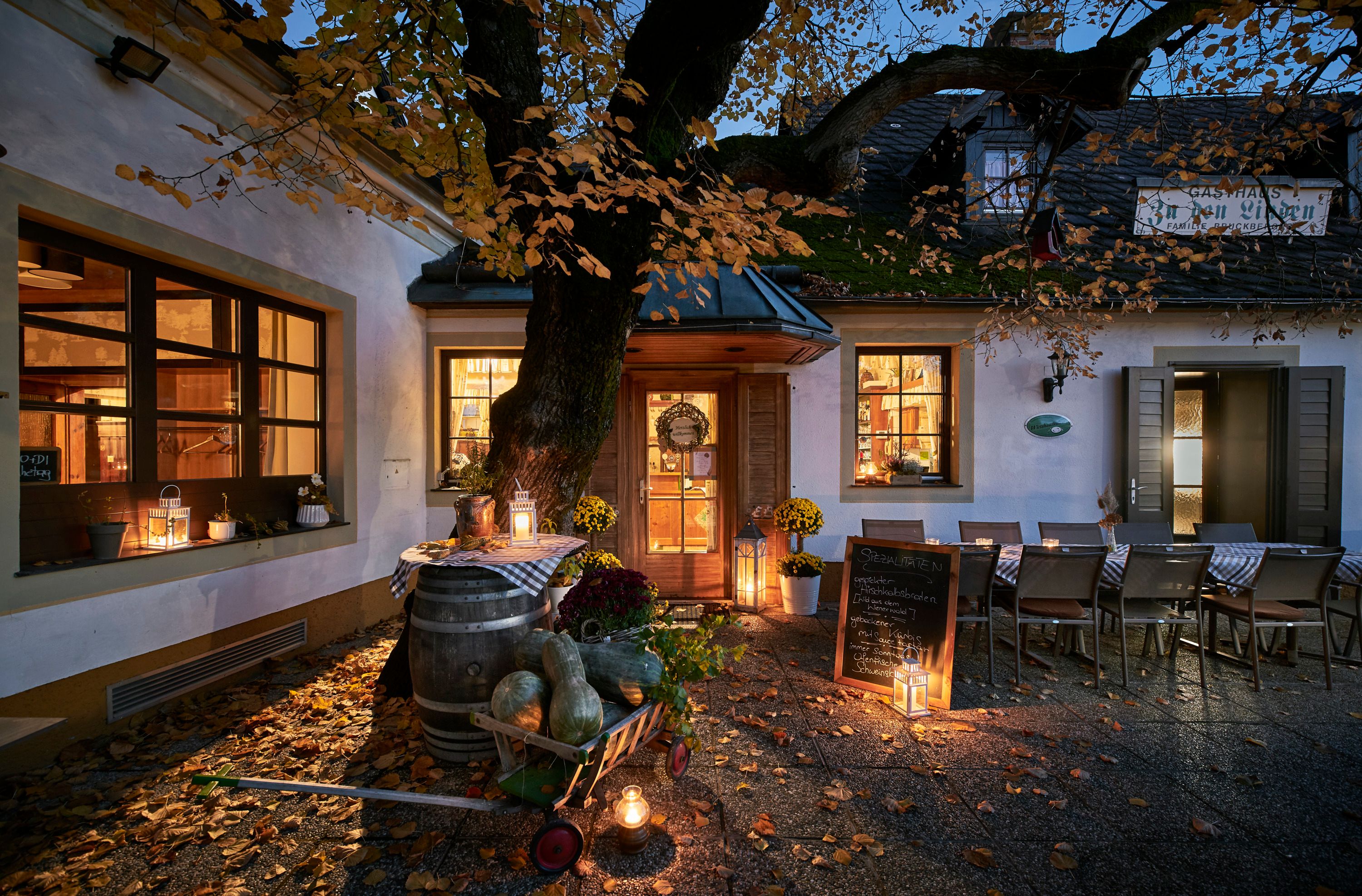 Cozy inn in the Vienna Woods with autumnal decorations and an inviting atmosphere.