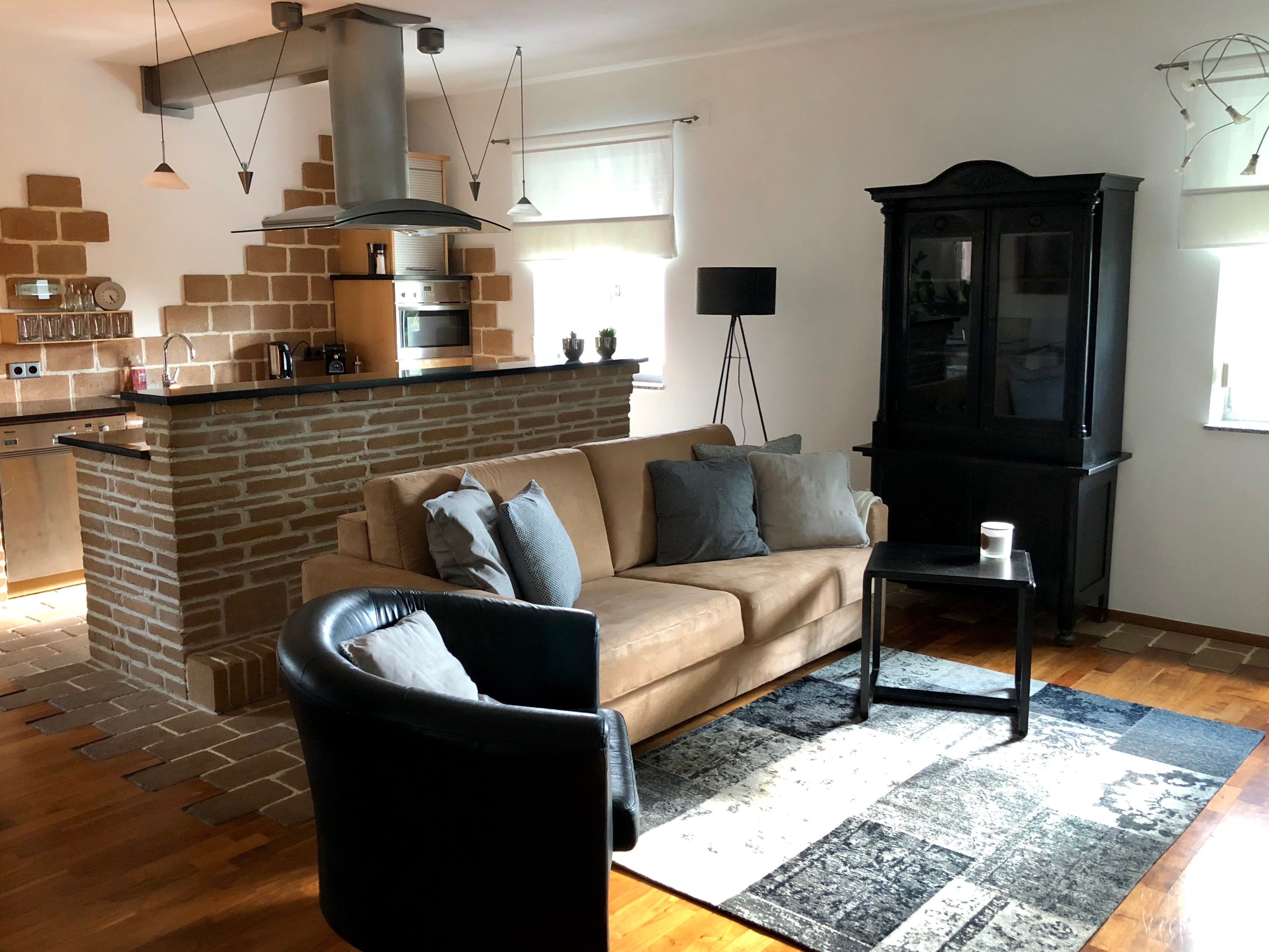 Bright, minimalist living space with simple furnishings