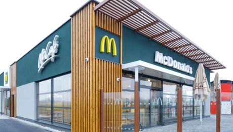 Exterior view of a modern McDonald's restaurant with McCafé logo.