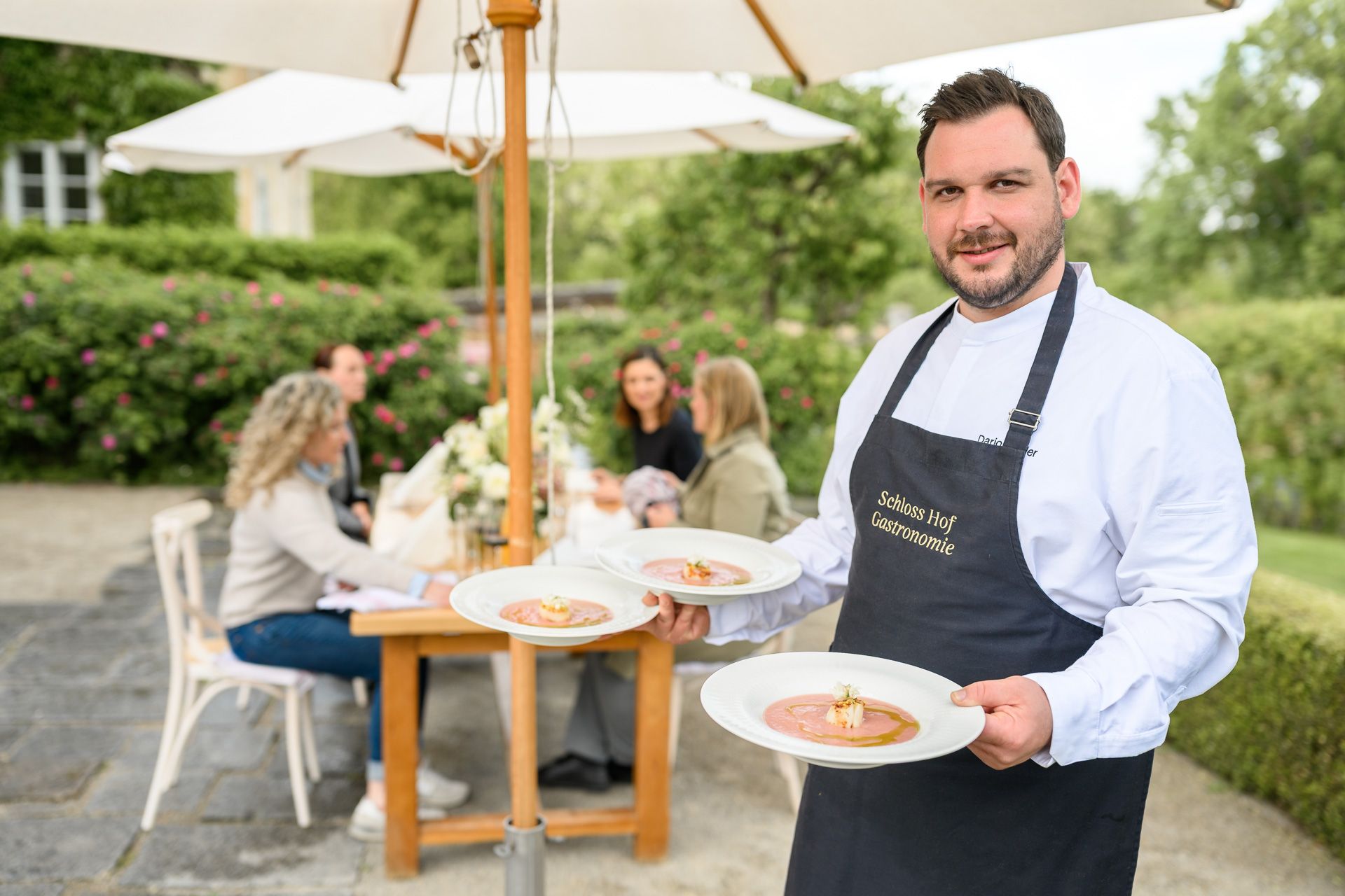 Chef serves dishes