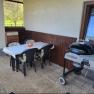 Terrace with table, chairs and barbecue.