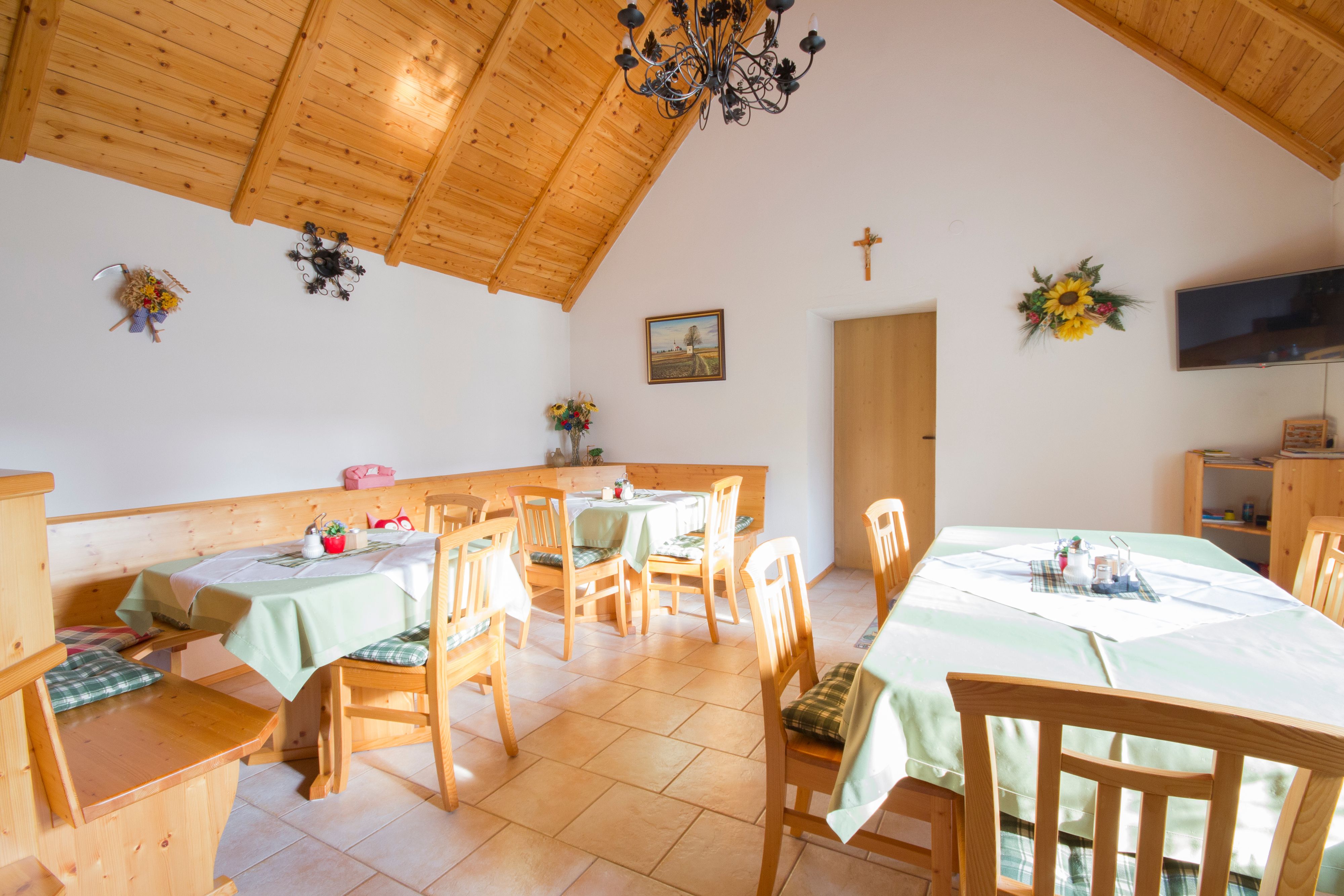 Cozy room with wooden furniture and decorated tables.
