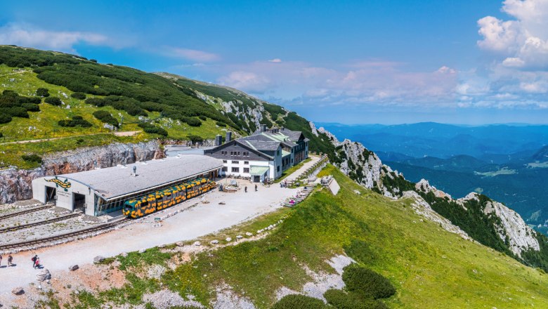 Summit station of the Schneebergbahn with panoramic views of the surrounding mountains.