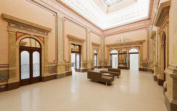 Interior view of the Arnulf Rainer Museum with elegant architecture and seating.