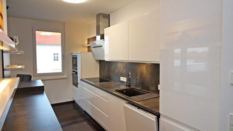 Kitchen with electrical appliances and window