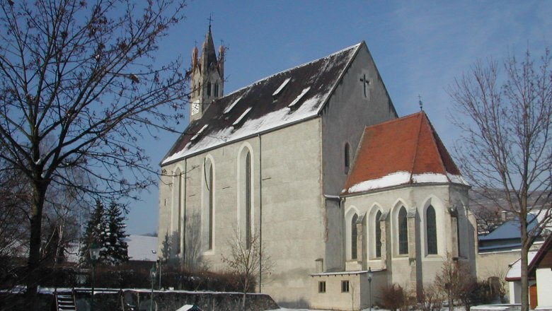 Imbach parish church covered with snow in winter.