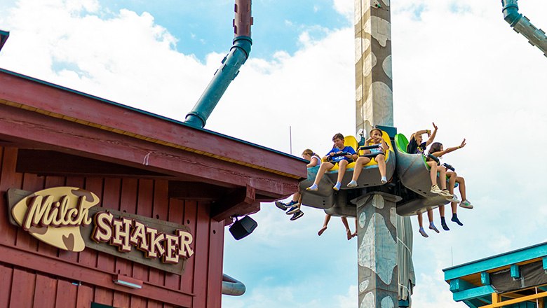 Children ride on the milk shaker ride in the Eis-Greissler adventure park.
