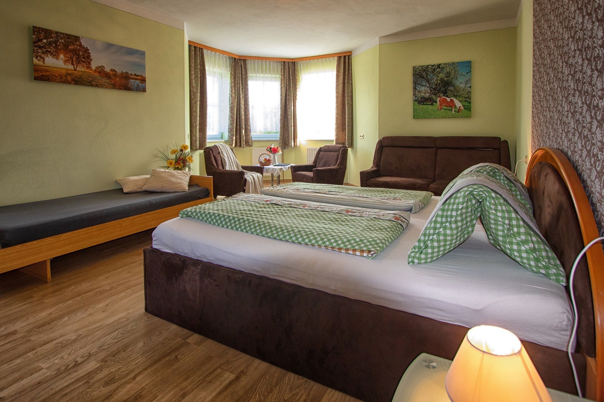 Room with double bed and sofa