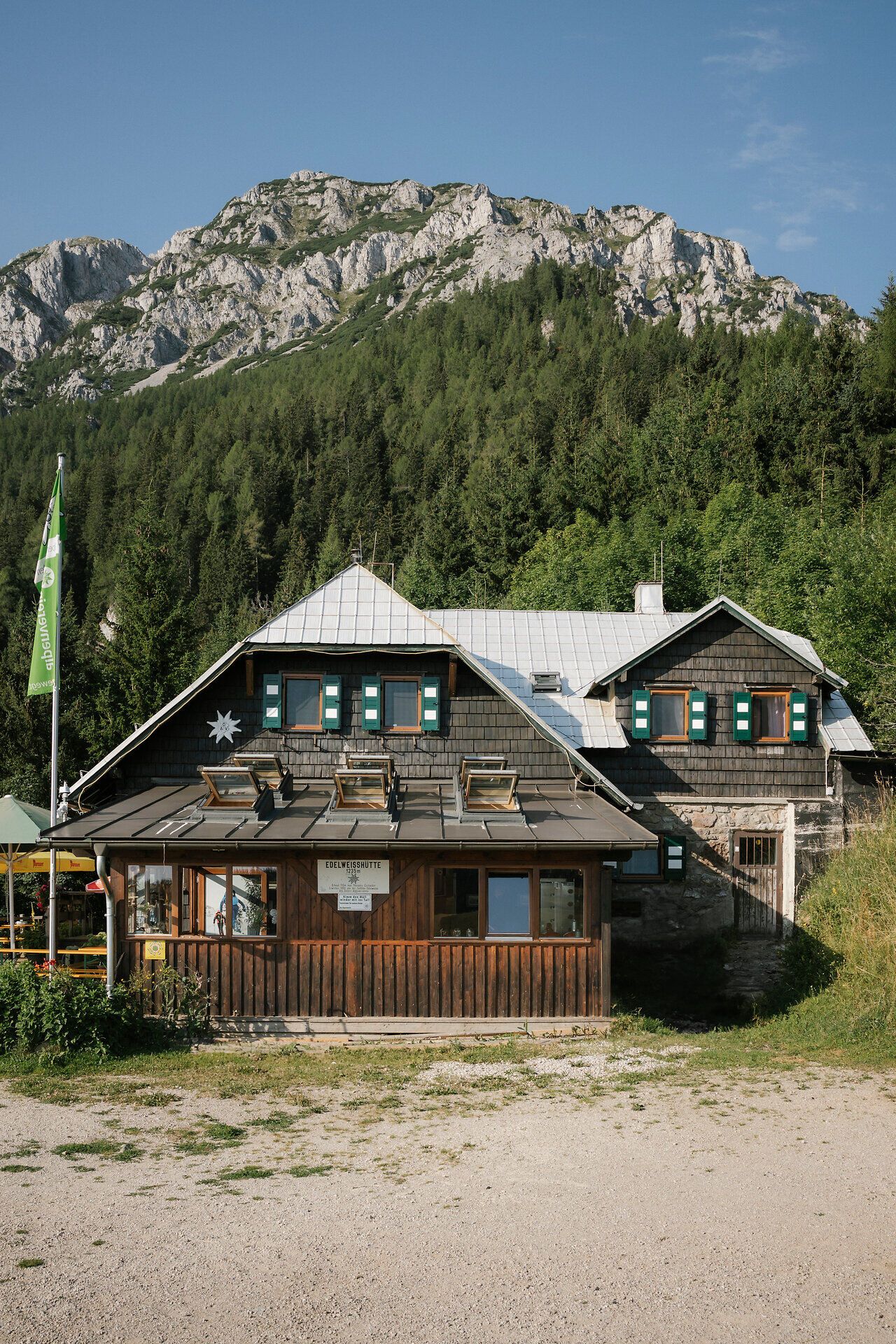 Exterior view of the Edelweiß Hut on Schneeberg with the rock massif in the background