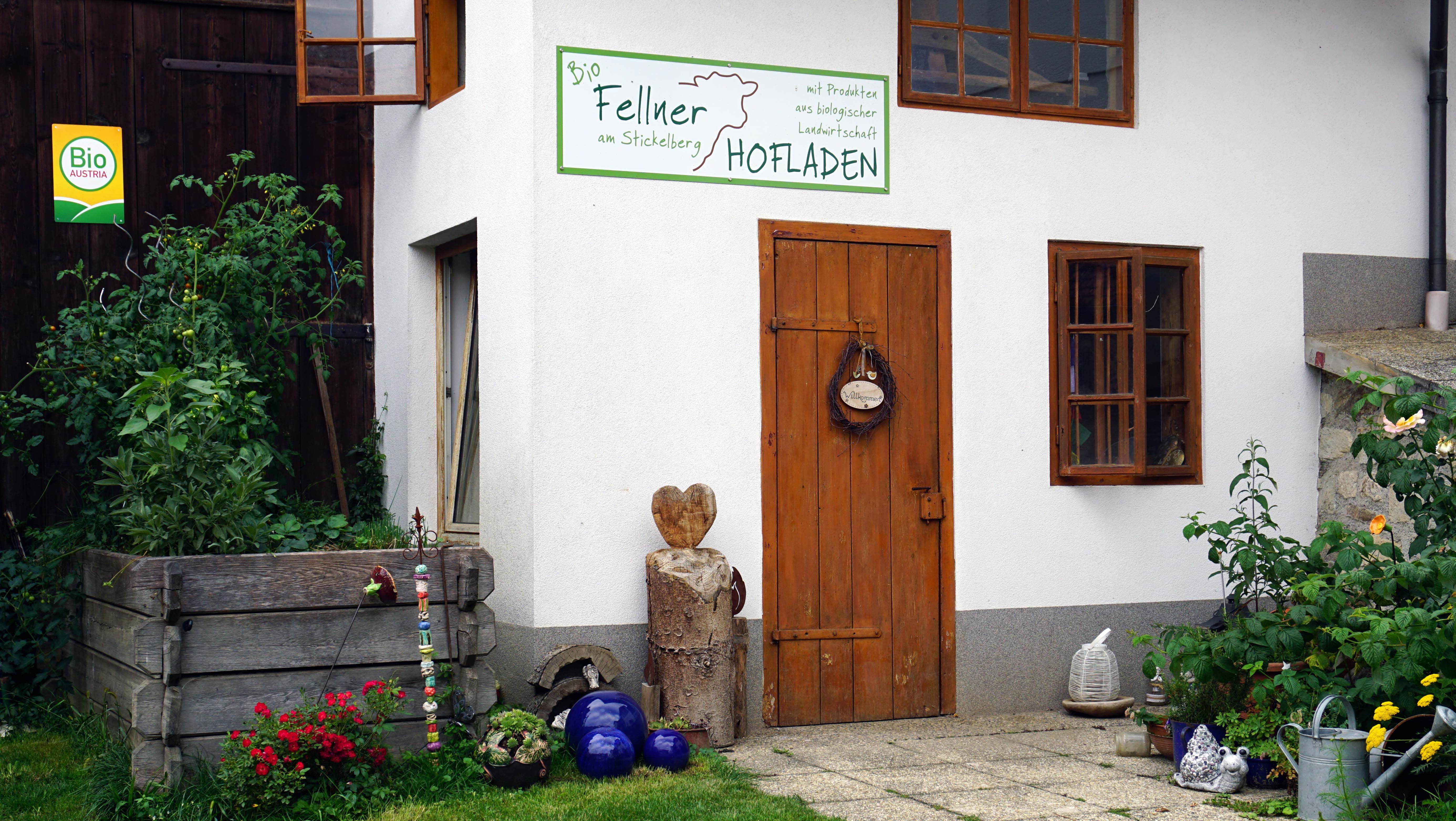 Farm store from the organic farm on Stickelberg with wooden door and plants.