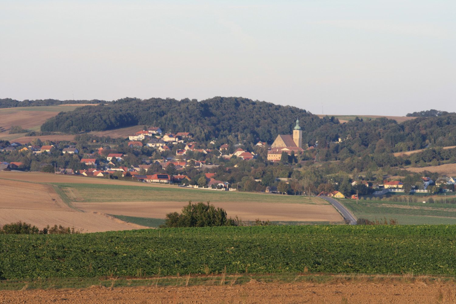 Panoramic view of Großrußbach with church and surrounding fields.