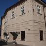 Exterior view of the Hotel Ur-Wachau with beige building and blue sky.