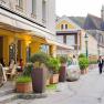 Street scene with café and church in the background.