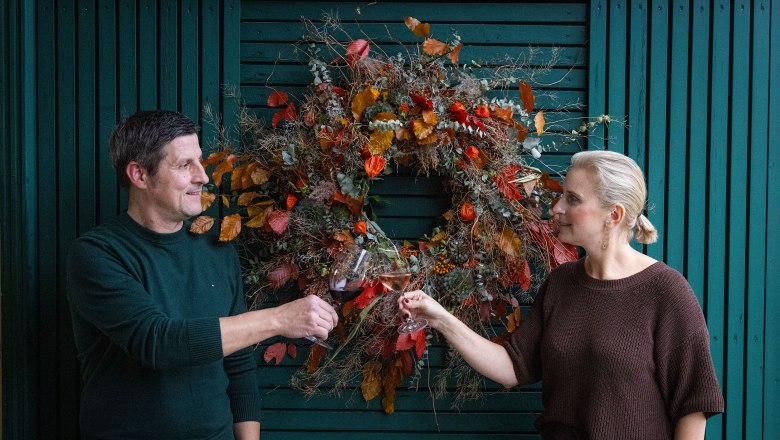 The owners of the winery at the entrance portal