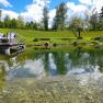 Swimming pond in May with footbridge, &copy; Ferienhaus Angel, Fotograf Heidi Angel