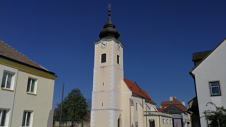 Rohrendorf parish church with blue sky in the background.