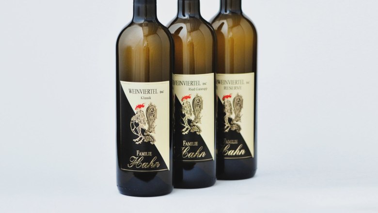 Three bottles of wine from the Hahn winery on a white background.