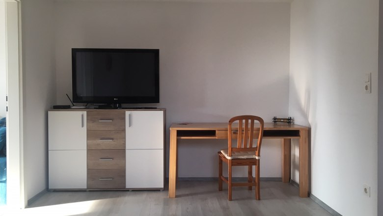 Living room with TV and desk