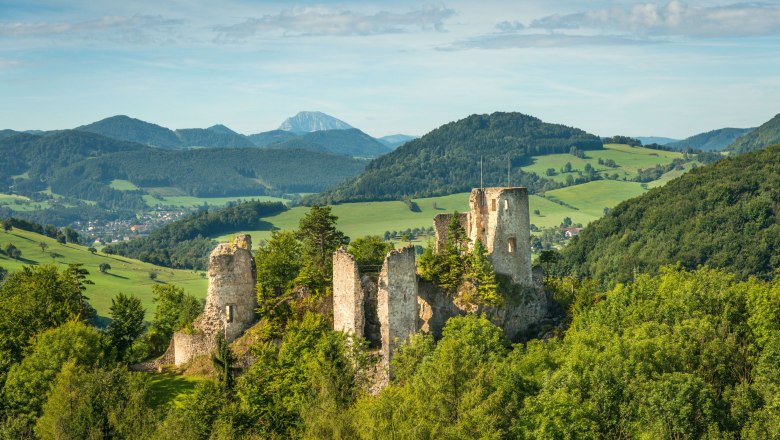 Rabenstein ruins amidst green hills and forests.