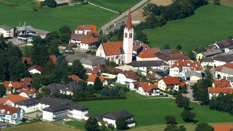 Aerial view of the municipality of Weistrach with church and surrounding houses.