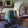 Two interior rooms: on the left a historic hall with paintings and a stove, on the right a chapel with an altar and chairs.