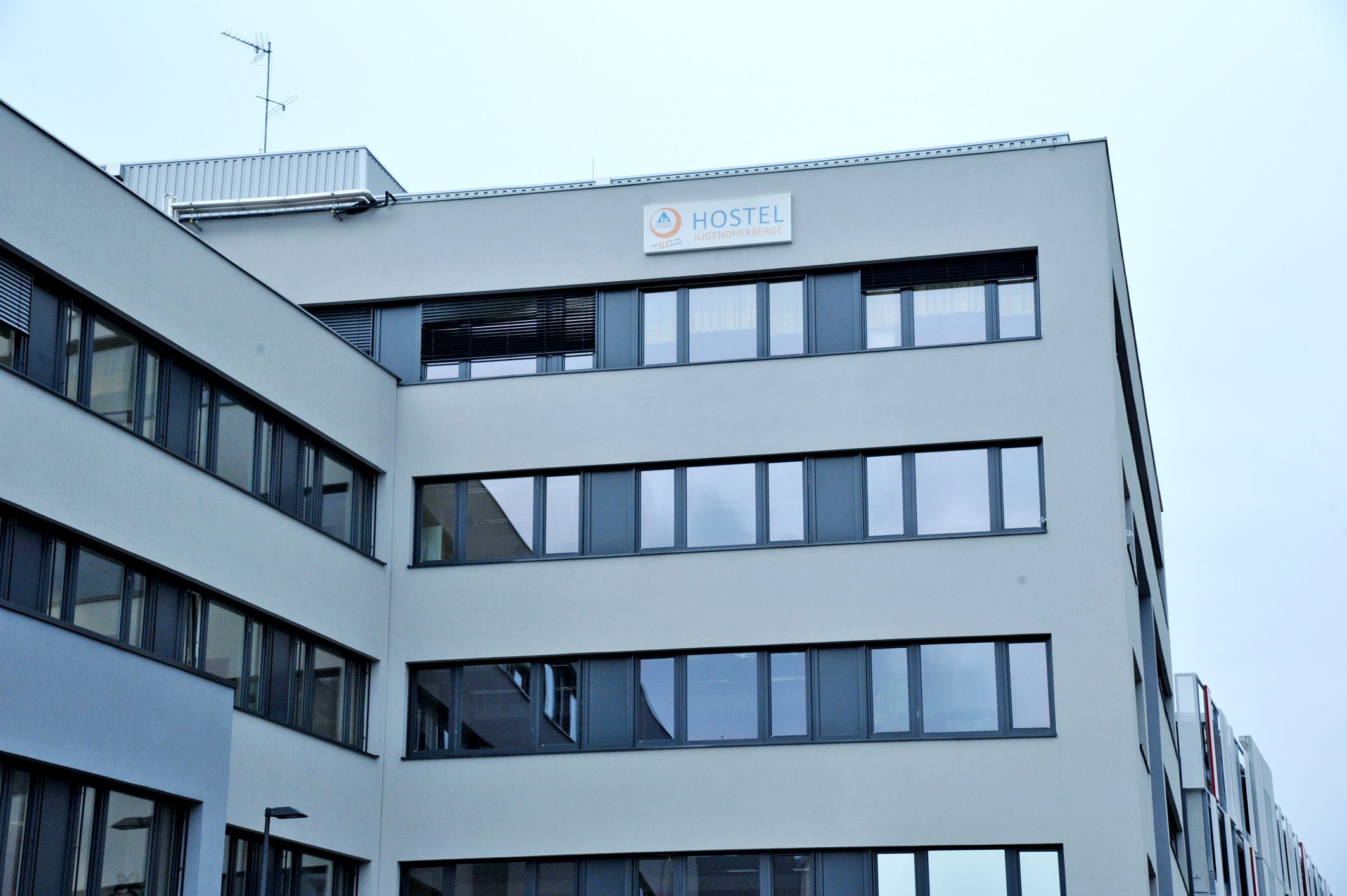 Modern building with 'Hostel Jugendherberge' sign.