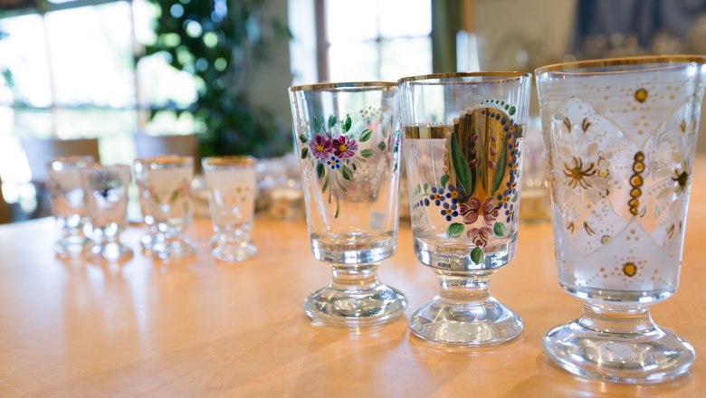 Close-up of artistically painted glasses on a table.