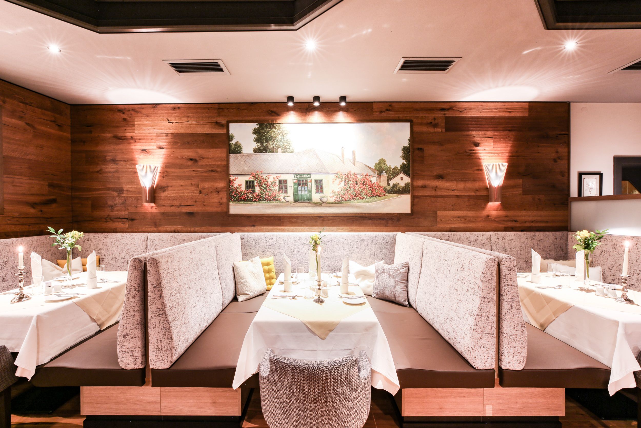 Seating areas and a laid table 