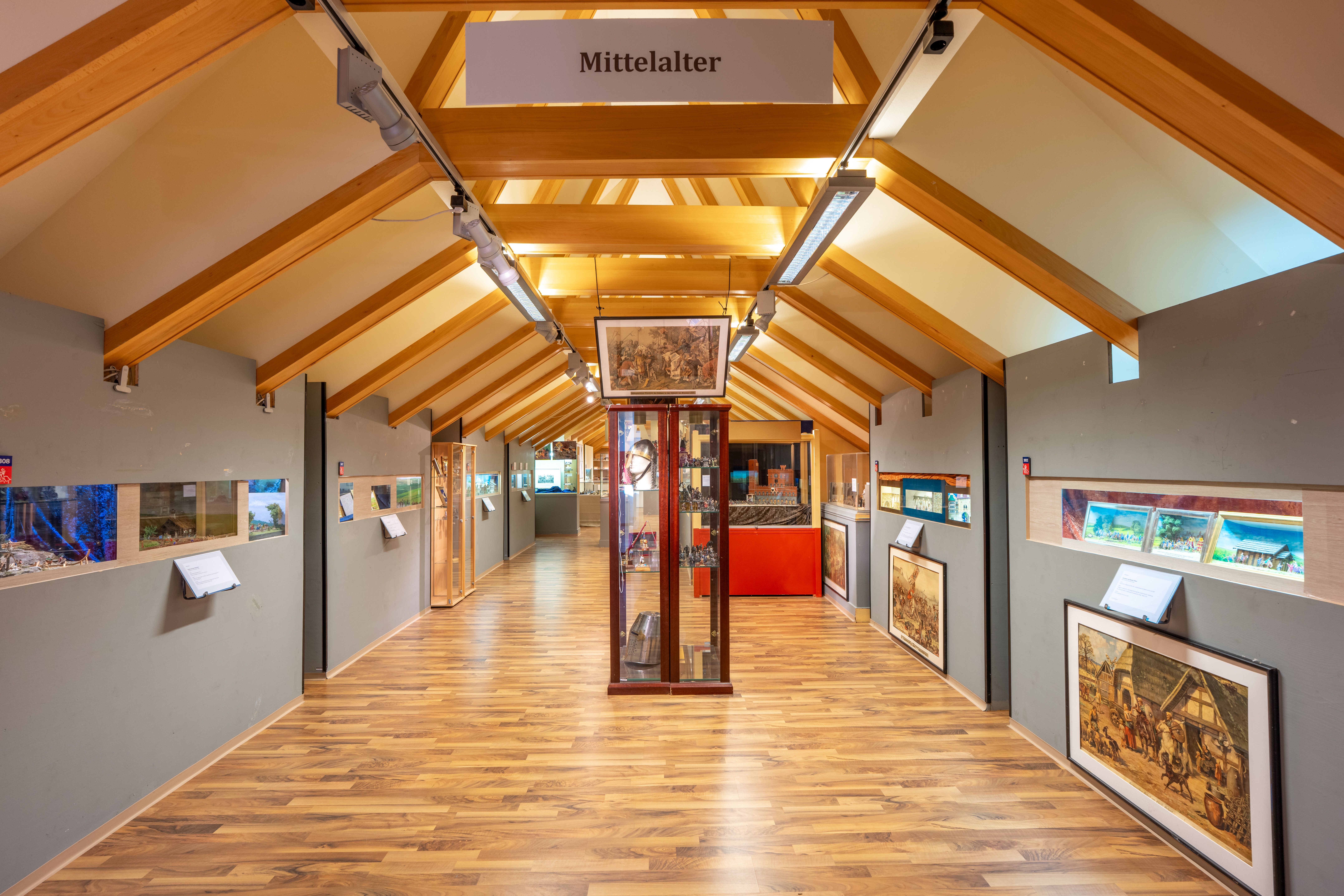 An exhibition space dedicated to the Middle Ages, featuring pewter figurines and historical displays.