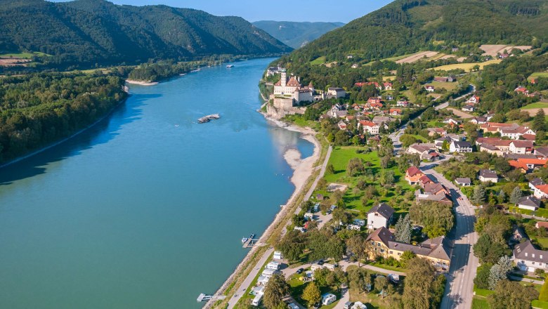 Aerial view of Sch&ouml;nb&uuml;hel-Aggsbach on the Danube with castle and surrounding landscape.