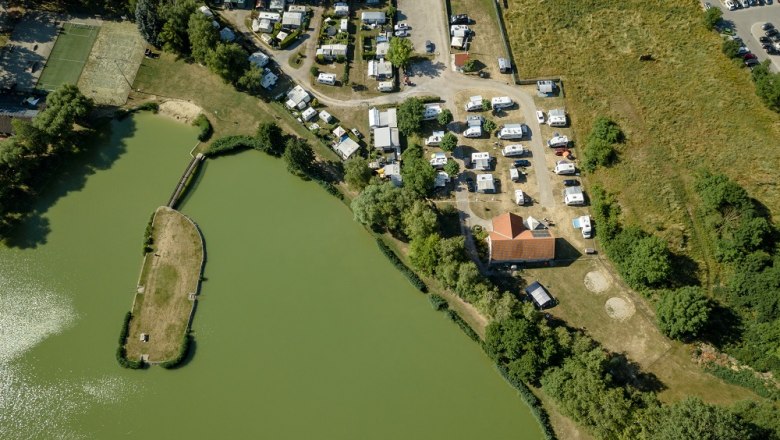 Aerial view of a bathing pond with campsite in Poysdorf.