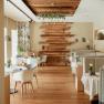 Interior view of an elegant restaurant with wooden floor, modern furniture and decorative wooden elements on the wall.