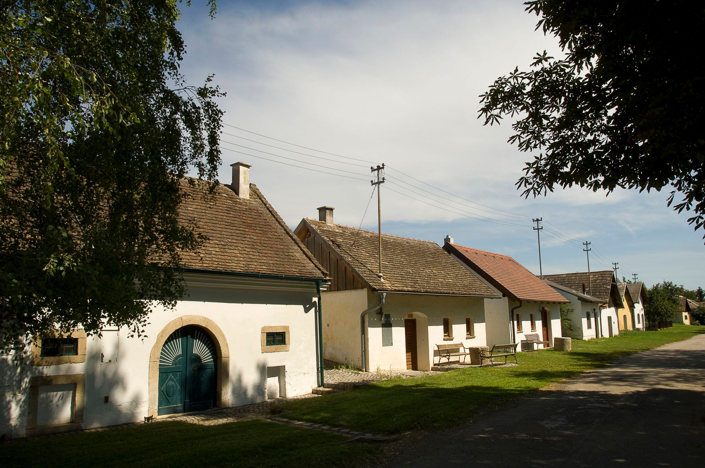 Row of wine cellars in Schöngrabern, Austria, in sunny weather.