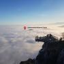 Skywalk Hohe Wand above a cloud cover with a view of the Johannesbachklamm Chalet.
