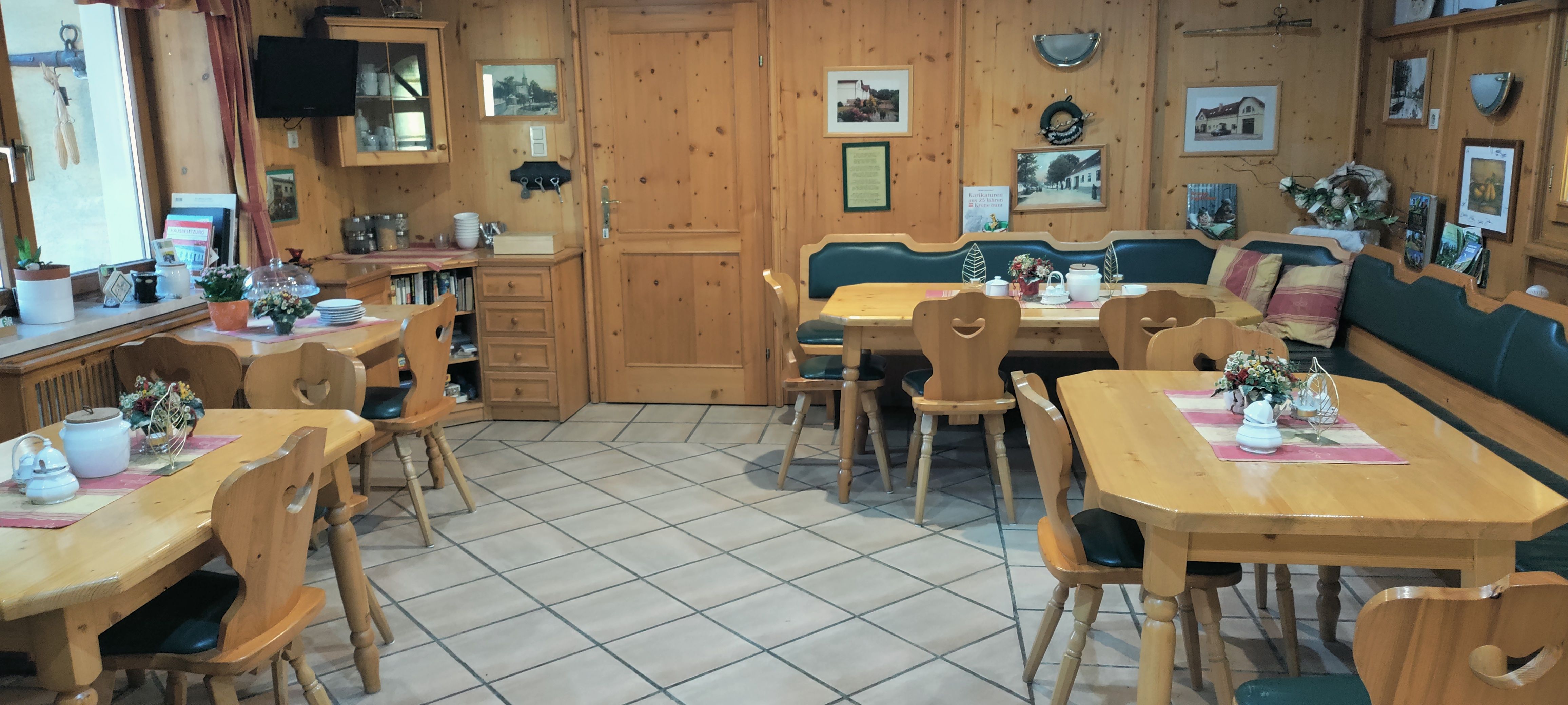 Cozy breakfast room with wooden furniture and decorations.