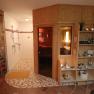 Shower area of the room with entrance to the sauna
