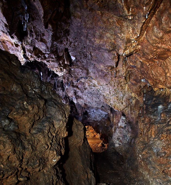 Interior view of the unicorn cave with stalactites on the ceiling.