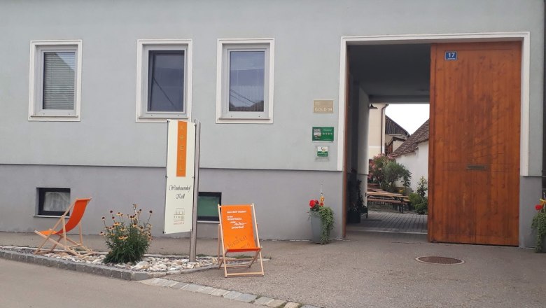 Krell Winery, © Weingut Krell Entrance to a winery with 'Krell' sign, deckchair and plants.