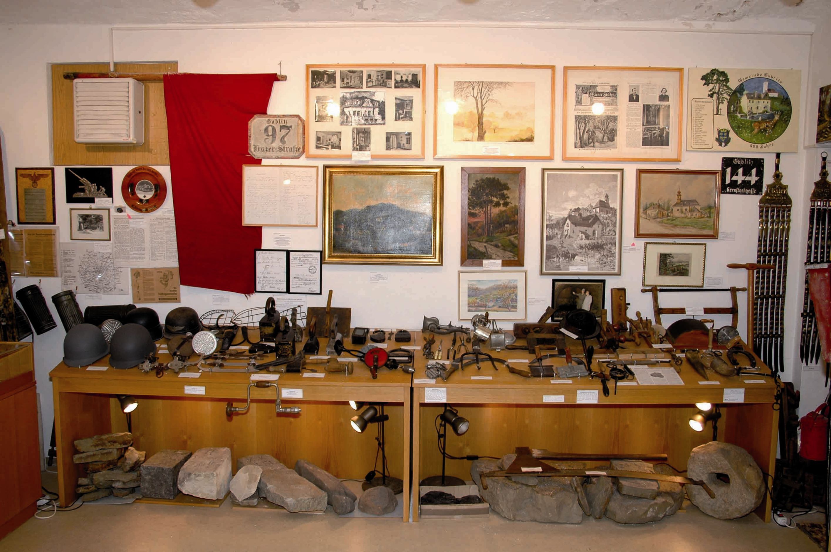 Exhibition in the Gablitz local history museum with historical tools and pictures.