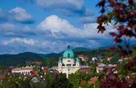 Town view of Berndorf with church and hills in the background.