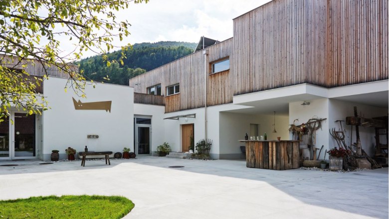 Modern building with wooden cladding and inner courtyard.