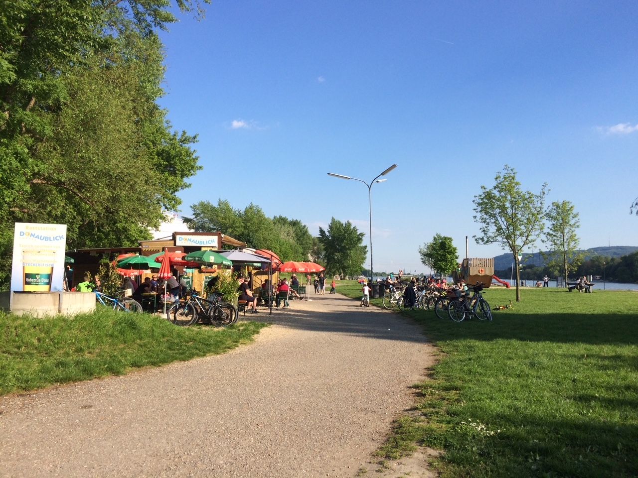 Cycle path with snack bar and bicycles along the Danube.