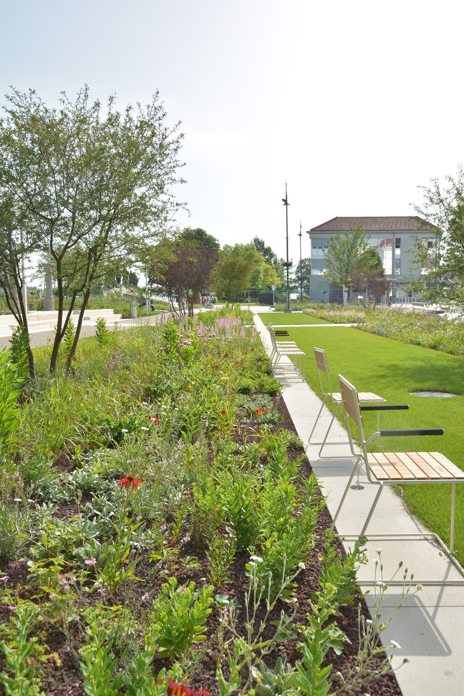 Benches to linger next to the flower bed