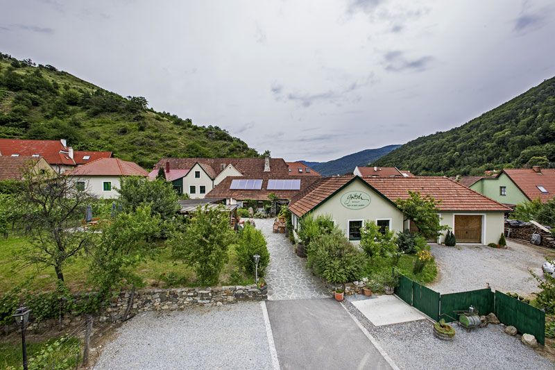 Gritsch winery in a green, hilly landscape.