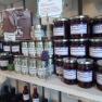 Shelf with jams and herbal salt in a farm store.