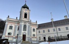 Servite monastery Mariahilfberg covered with snow in winter.
