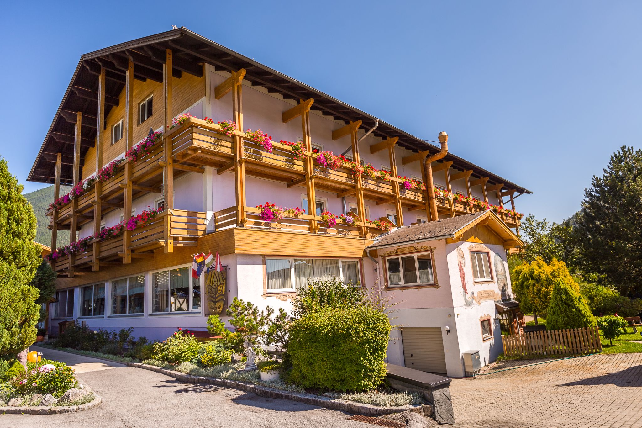 Paradise spring pink house view with wooden balconies 